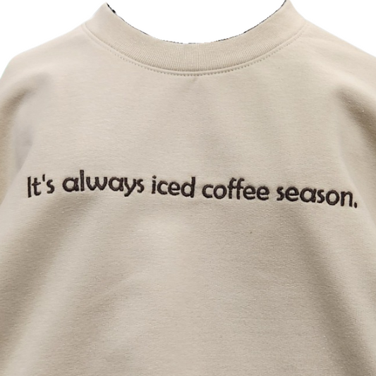 It's always iced coffee season. Sand color Embroidered Adult Sweatshirt