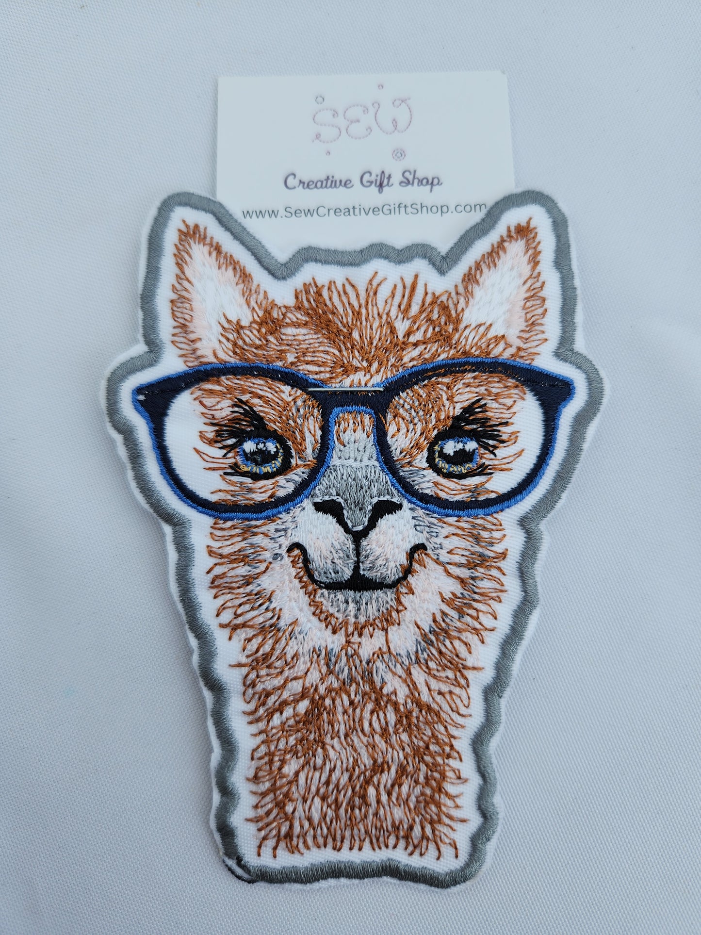 Llama with glasses embroidered iron-on patch