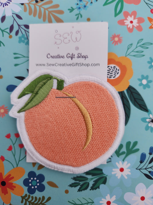 Peach embroidered iron-on patch