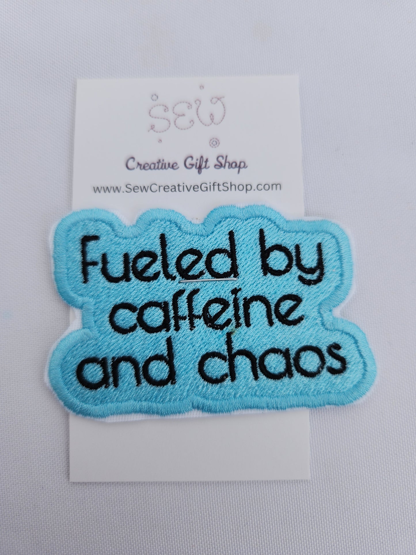 Fueled by caffeine and chaos embroidered iron-on patch